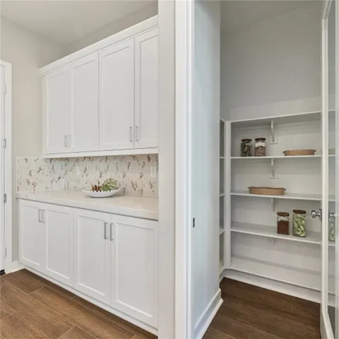 a view of cabinets and wooden floor