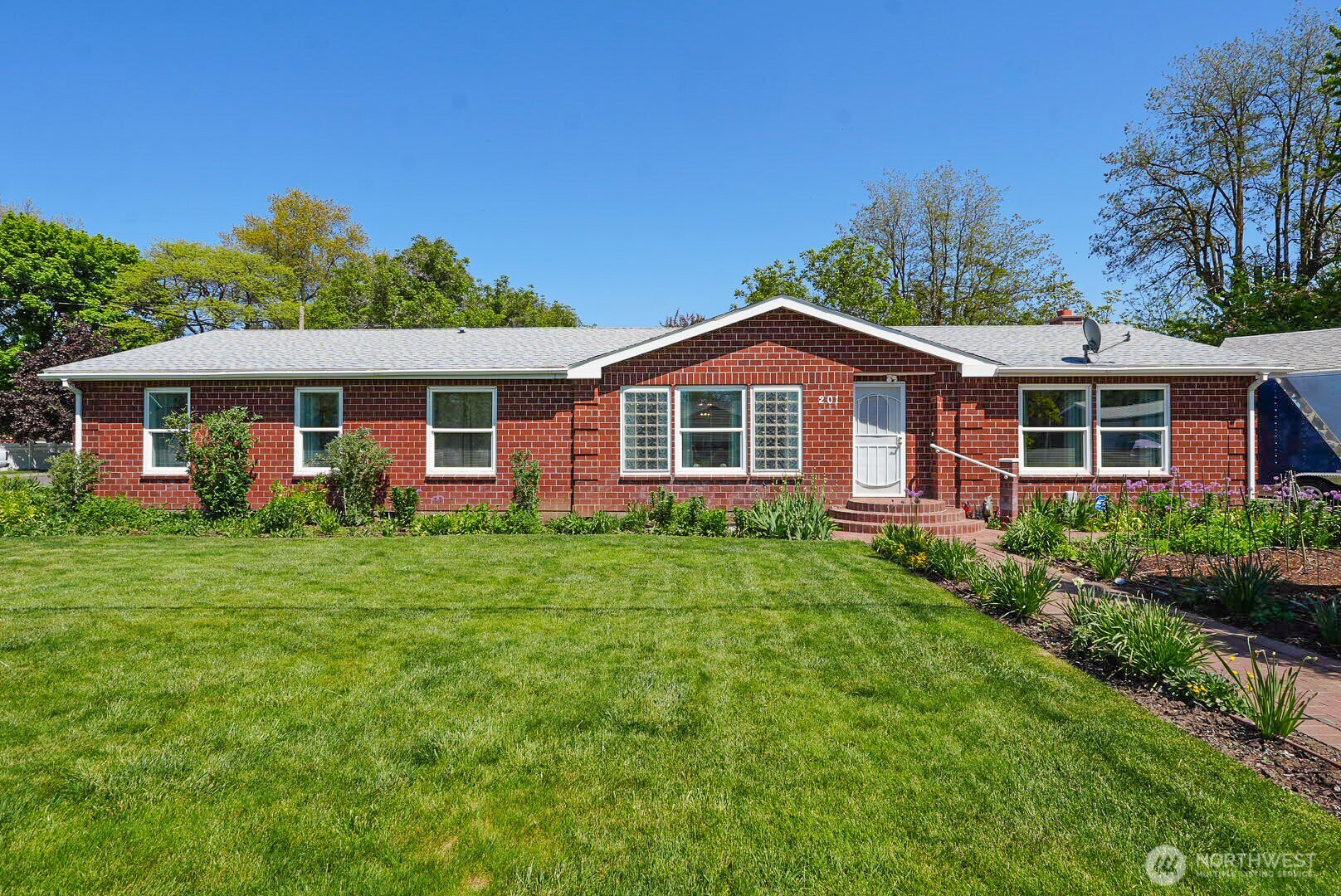 front view of a house with a yard