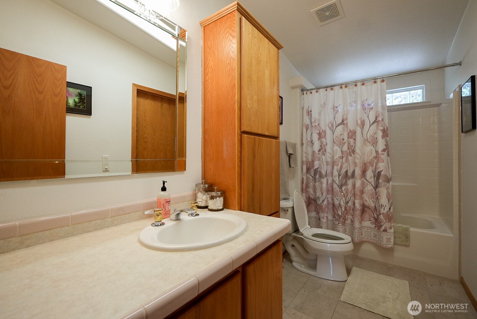 201 South Cherry Street Dayton, WA 99328 - Photo 16 of 23 a bathroom with a sink a toilet and shower