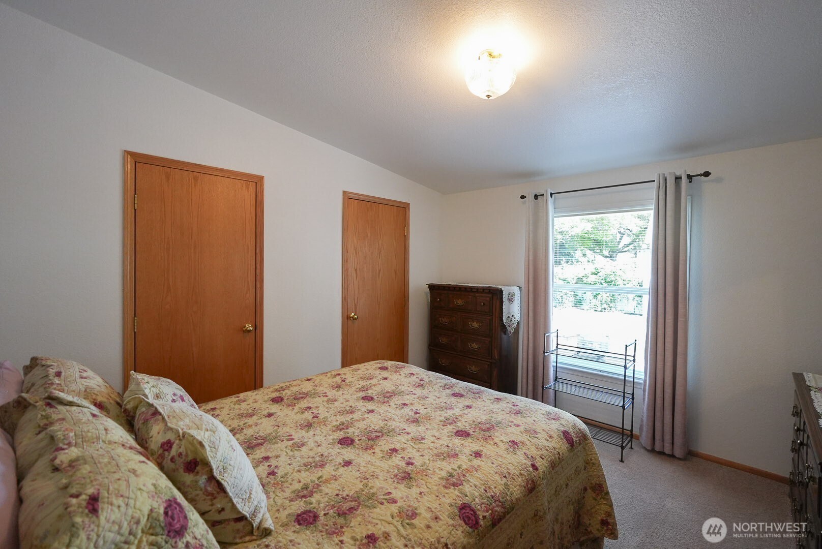 201 South Cherry Street Dayton, WA 99328 - Photo 17 of 23 a bedroom with a bed and a window