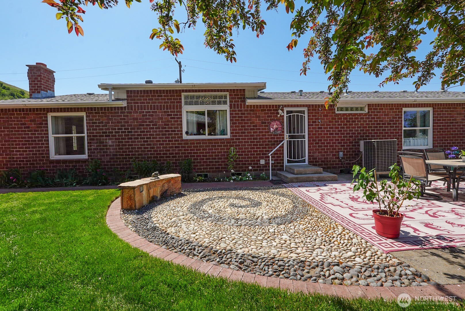 201 South Cherry Street Dayton, WA 99328 - Photo 6 of 23 a view of a house with backyard sitting area and garden