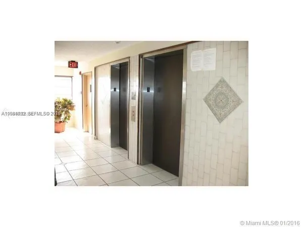 a picture of a bathroom with a shower