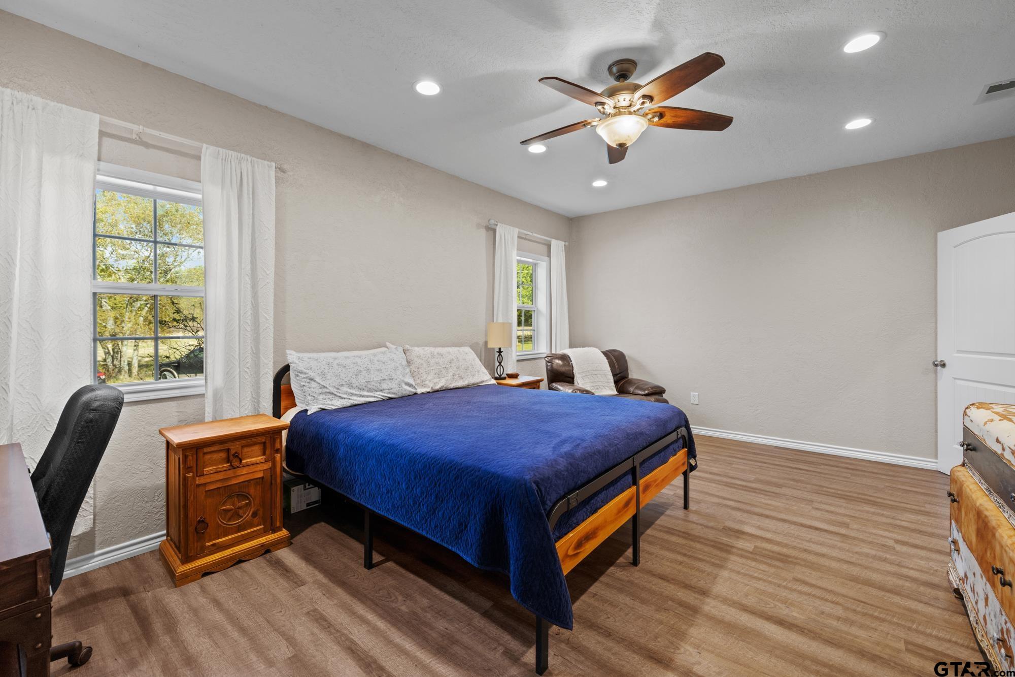 732 Red Maple Road Big Sandy, TX 75755 - Photo 12 of 40 a bedroom with a bed and a ceiling fan