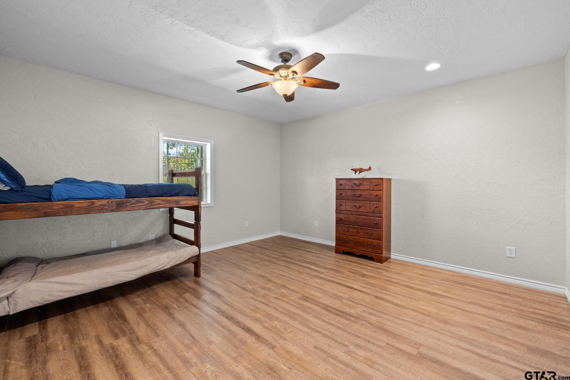 732 Red Maple Road Big Sandy, TX 75755 - Photo 17 of 40 a bedroom with a bed and a window
