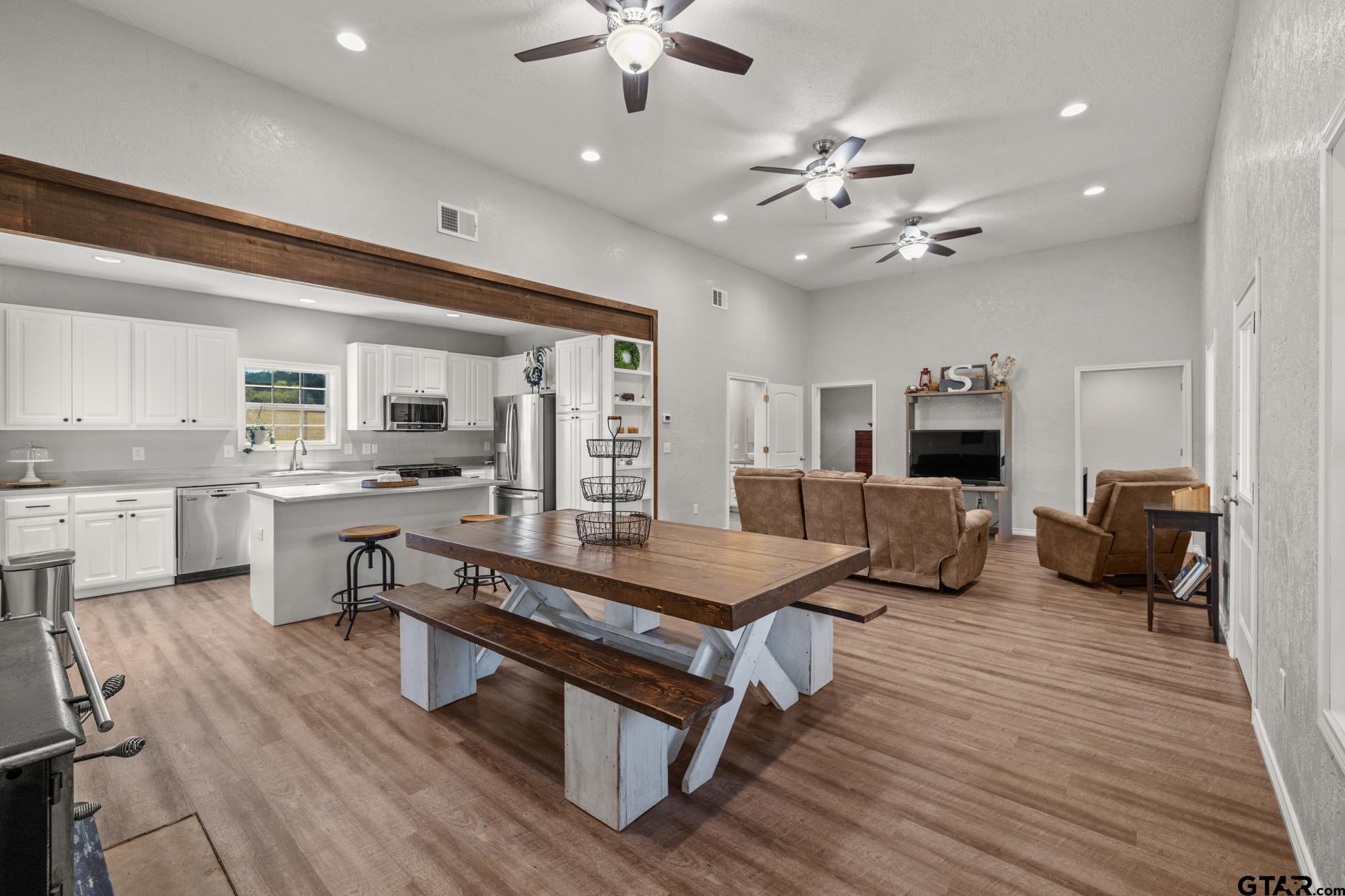 732 Red Maple Road Big Sandy, TX 75755 - Photo 2 of 40 a living room with furniture kitchen view and a large window