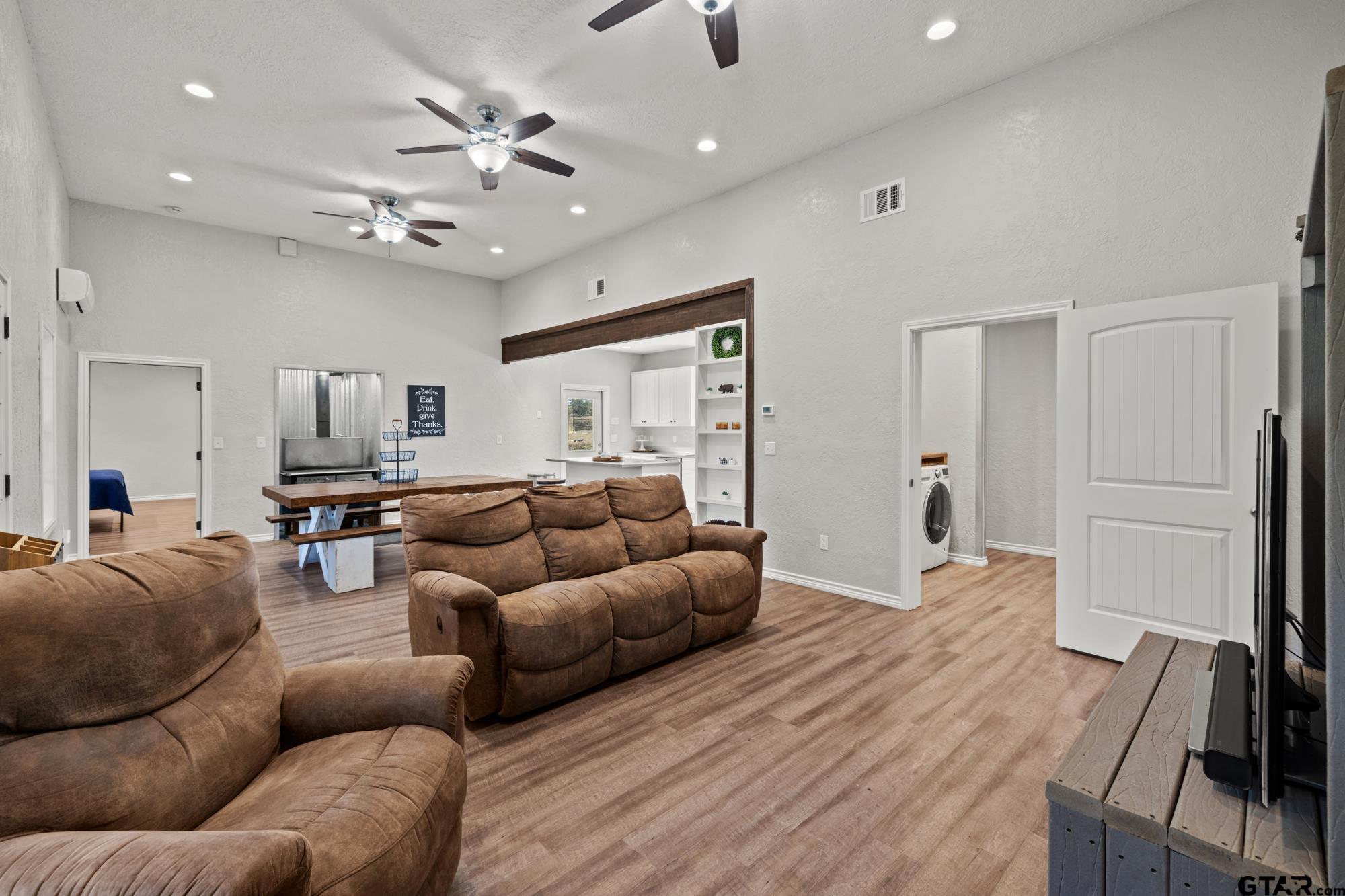732 Red Maple Road Big Sandy, TX 75755 - Photo 25 of 40 a living room with furniture and a chandelier