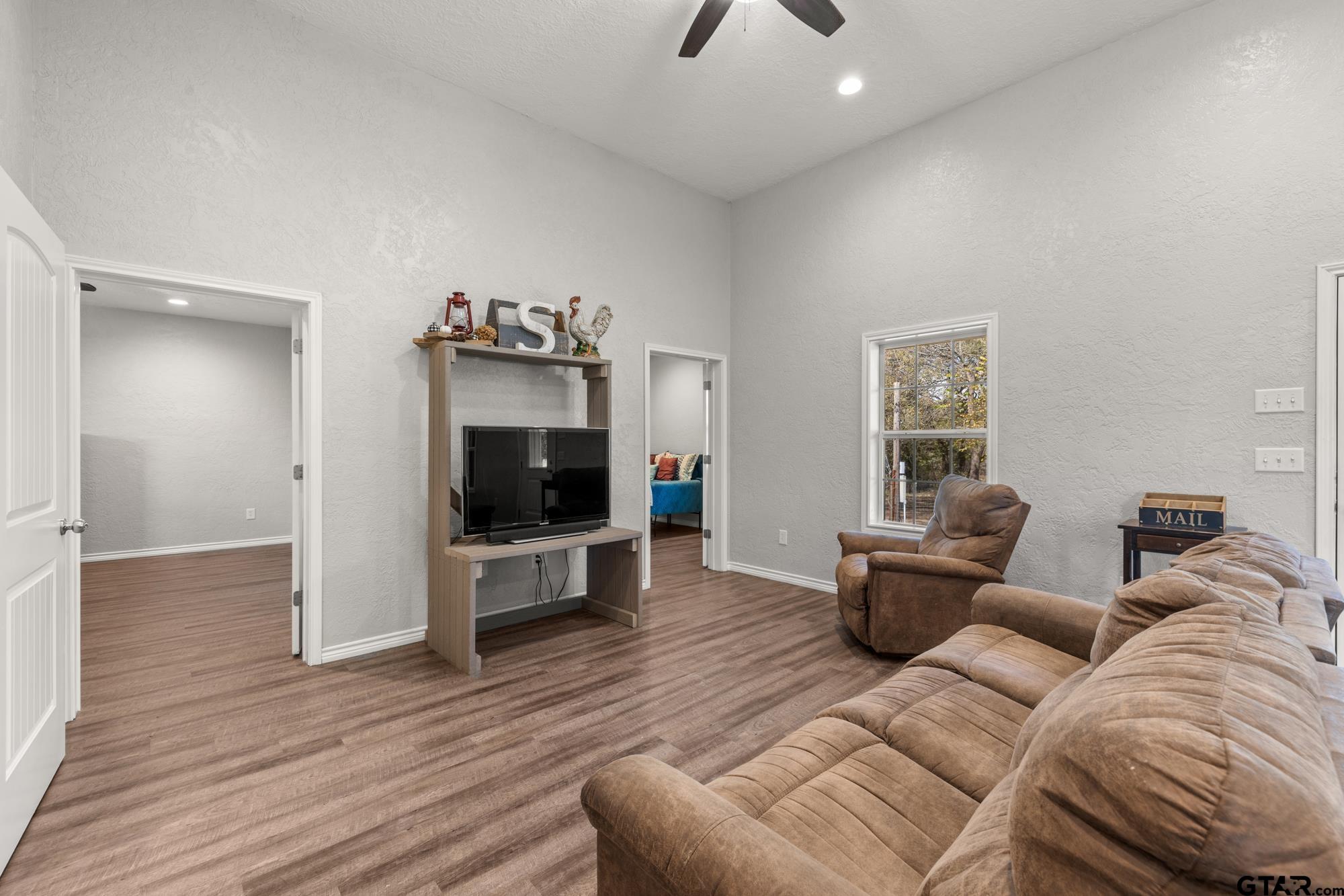 732 Red Maple Road Big Sandy, TX 75755 - Photo 27 of 40 a living room with furniture and a flat screen tv