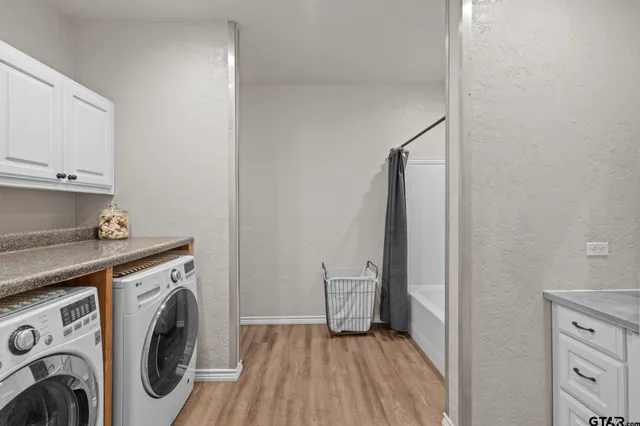a view of a storage & utility room with washer and dryer