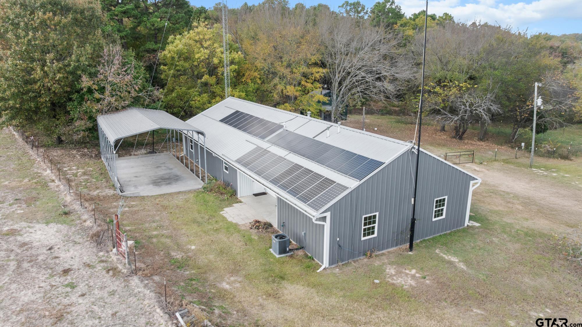 732 Red Maple Road Big Sandy, TX 75755 - Photo 39 of 40 an aerial view of a house with a yard and large tree