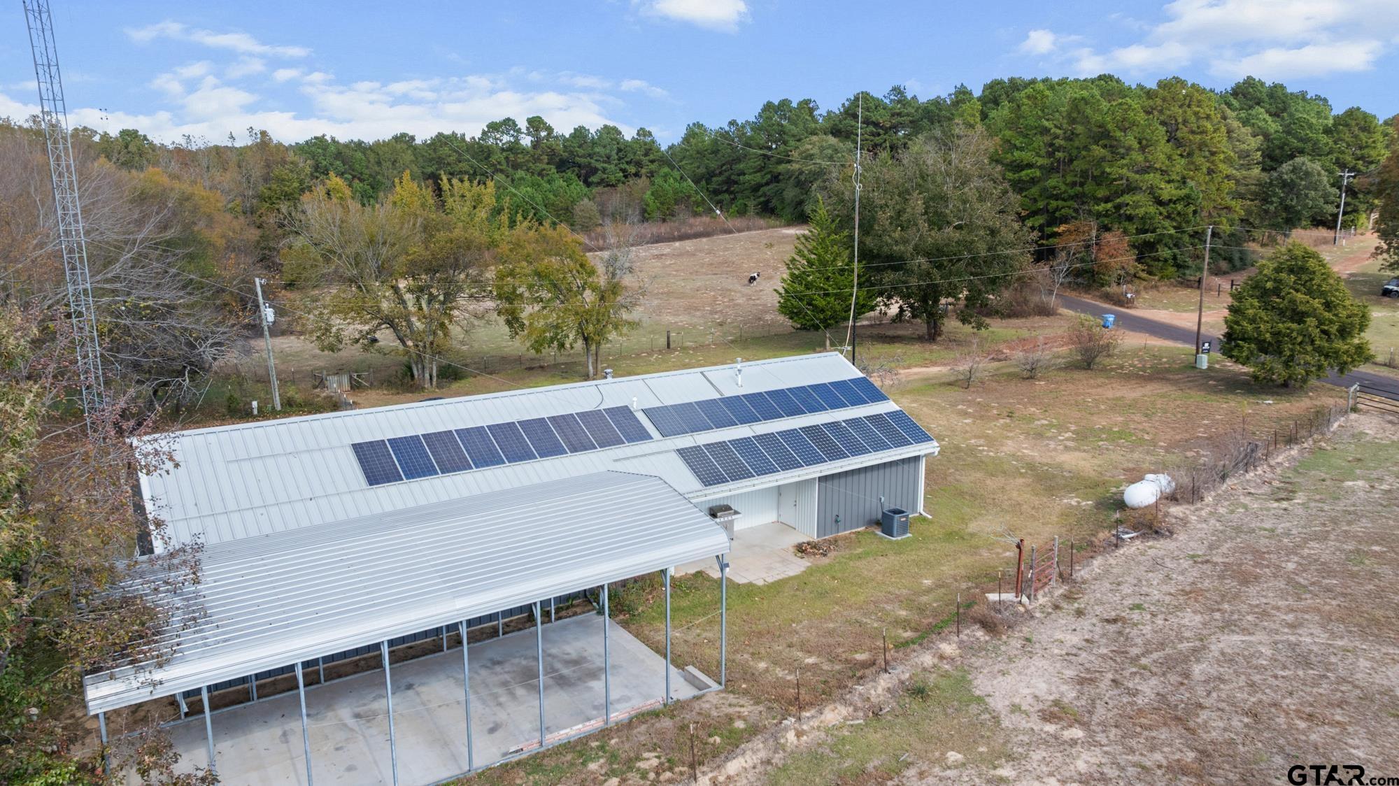 732 Red Maple Road Big Sandy, TX 75755 - Photo 4 of 40 a view of a chairs and table in the back yard