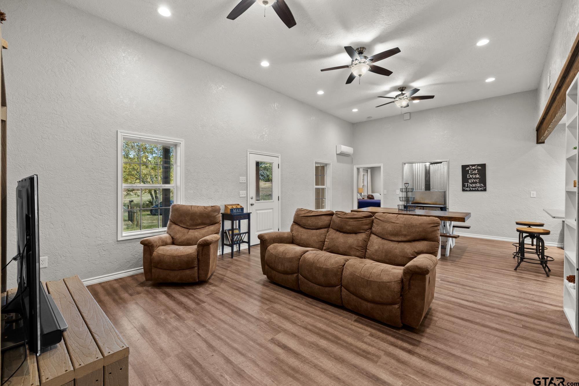 732 Red Maple Road Big Sandy, TX 75755 - Photo 7 of 40 a living room with furniture and a flat screen tv