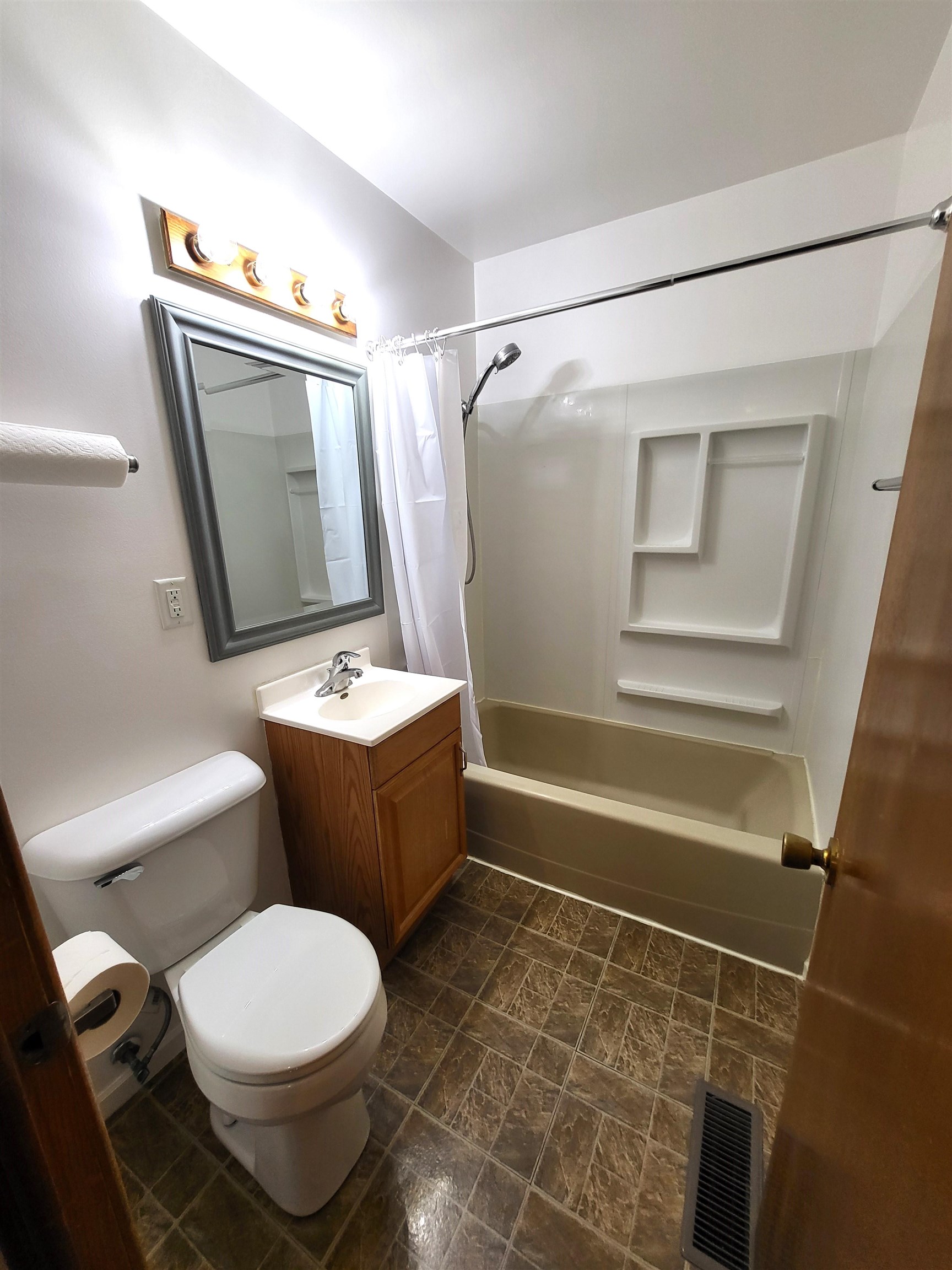 7805 Randy Road Machesney Park, IL 61115 - Photo 10 of 14 a bathroom with a toilet sink and shower
