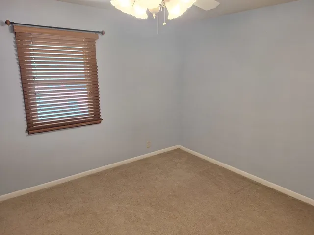 an empty room with a bathroom