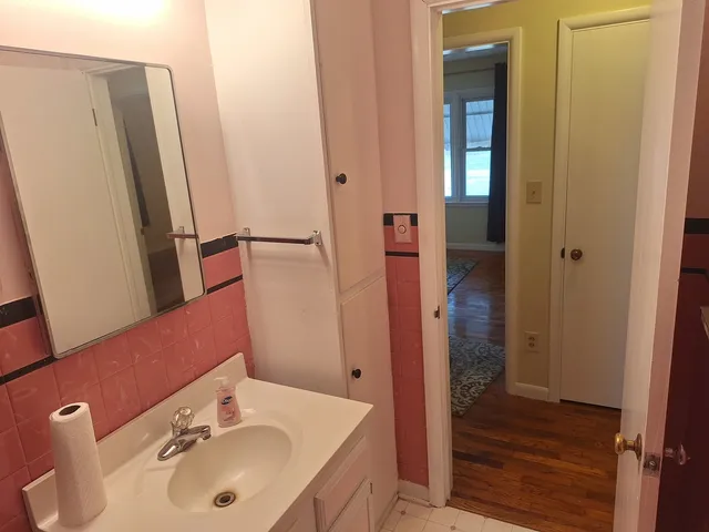 a view of a room with wooden floor and closet