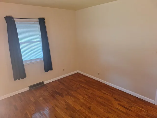 a view of a backyard with sitting area