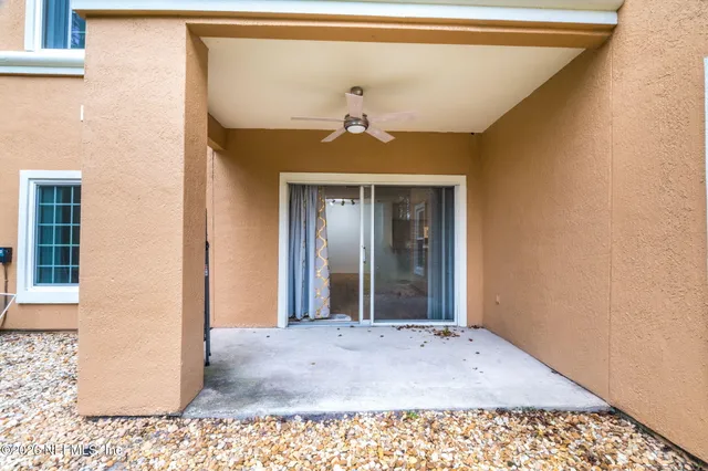 a view of a hallway with a chandelier