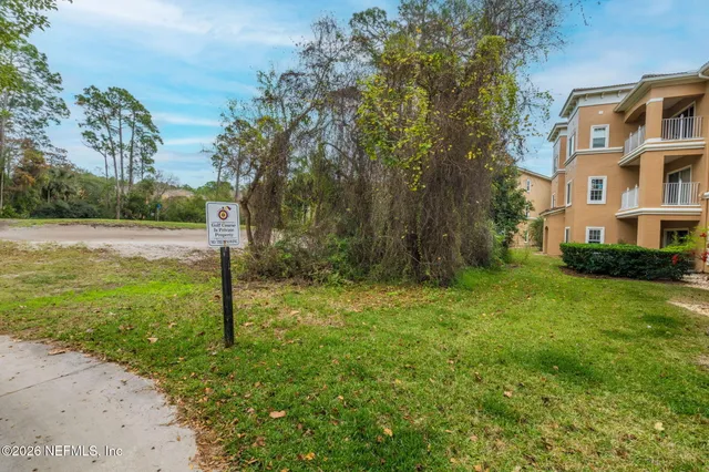 a view of a yard in front of a house