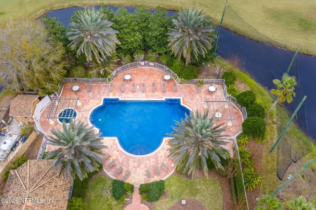 a view of a lake with a table and chairs
