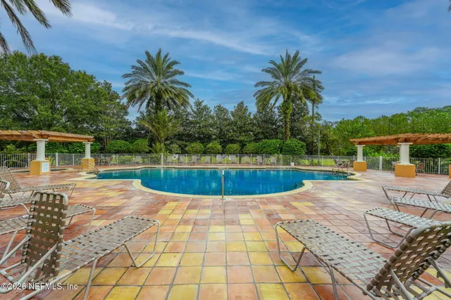 a view of a swimming pool with a patio