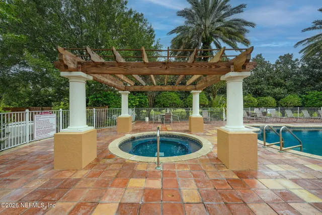 a view of fountain with tree in the background