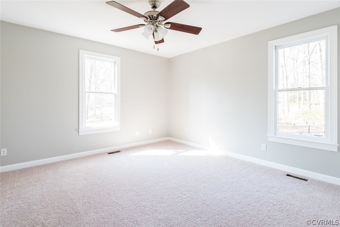 13130 Queensgate Road Midlothian, VA 23114 - Photo 27 of 42 an empty room with a window and a fan