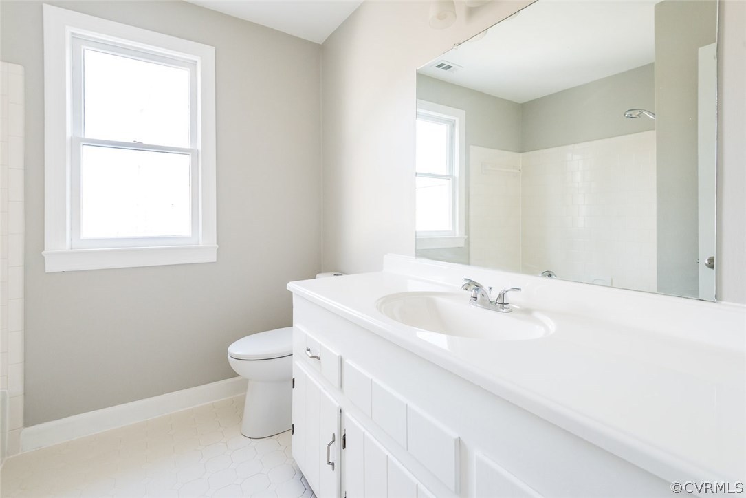 13130 Queensgate Road Midlothian, VA 23114 - Photo 29 of 42 a bathroom with a toilet sink and mirror