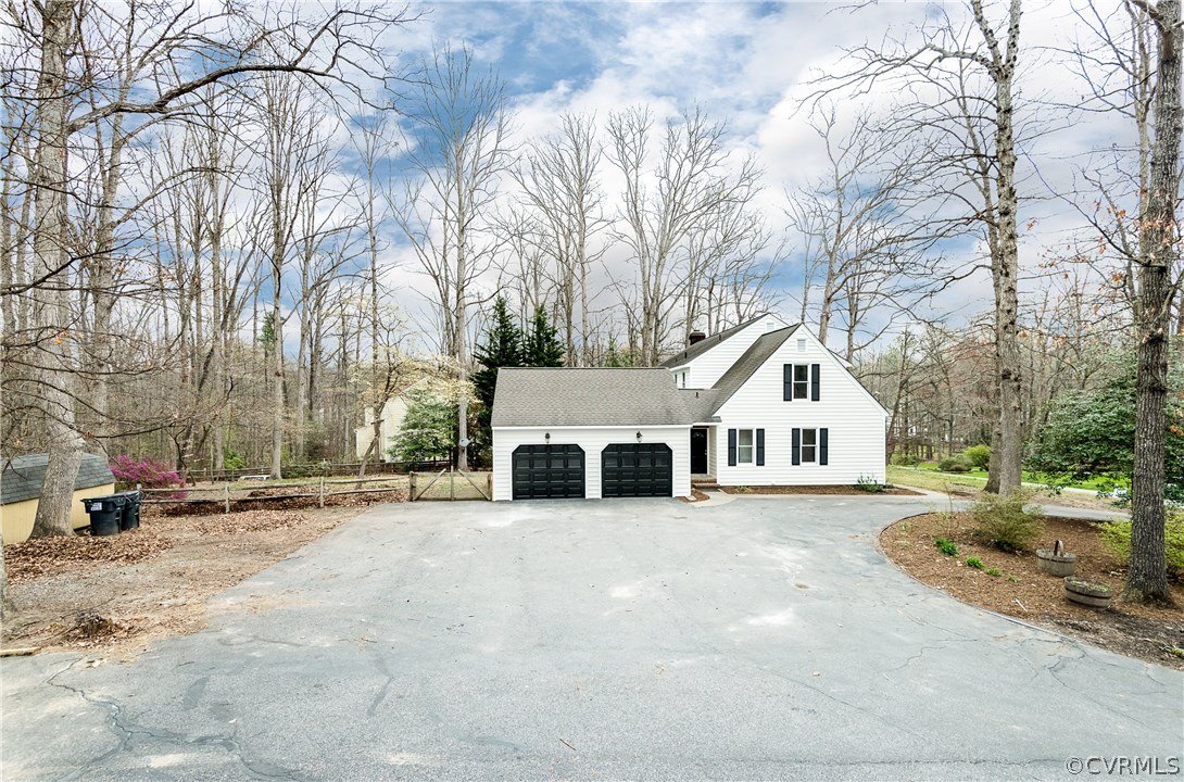 13130 Queensgate Road Midlothian, VA 23114 - Photo 42 of 42 a view of a white house with a big yard and large trees