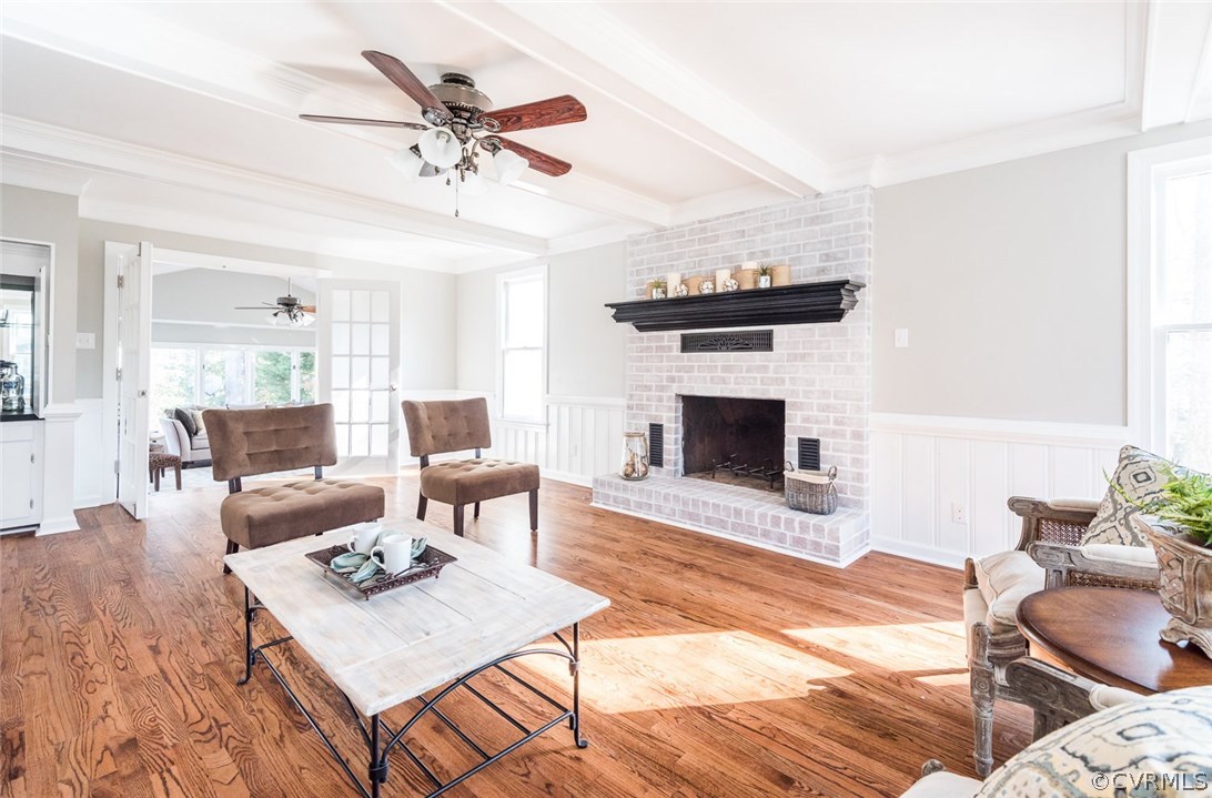 13130 Queensgate Road Midlothian, VA 23114 - Photo 7 of 42 a living room with furniture a fireplace and a chandelier