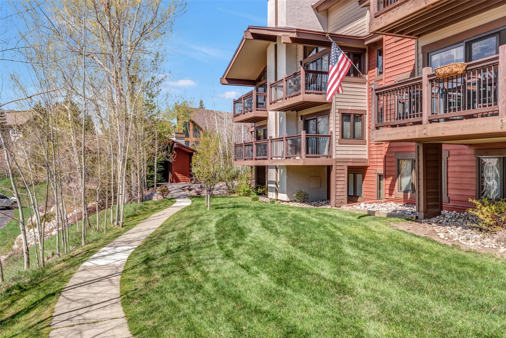 1675 Ranch Road, Unit 411 Steamboat Springs, CO 80487 - Photo 39 of 48 View of back deck featuring a yard