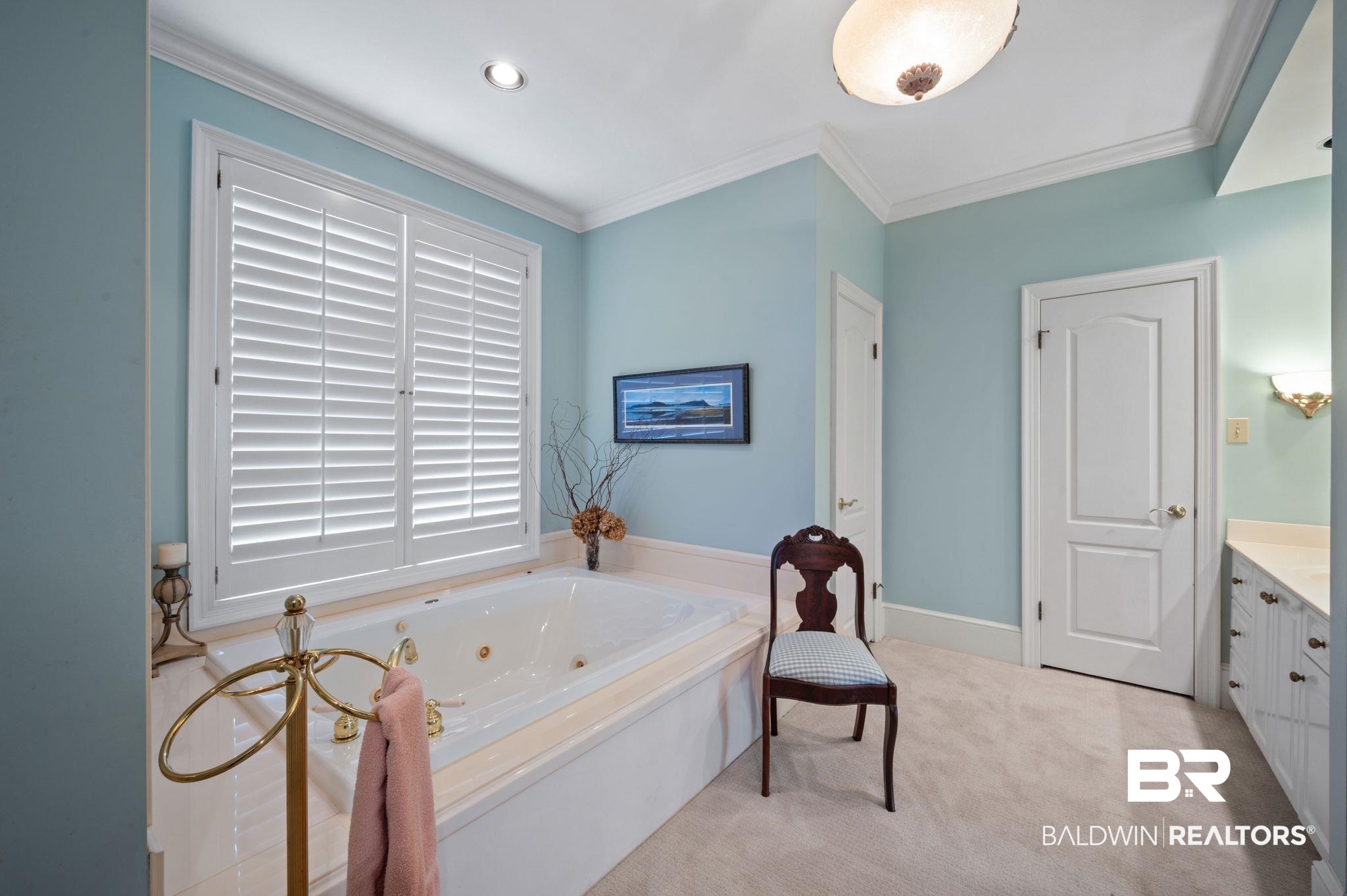 31800 River Road Orange Beach, AL 36561 - Photo 31 of 69 Bathroom featuring a bathing tub, vanity, and ornamental molding