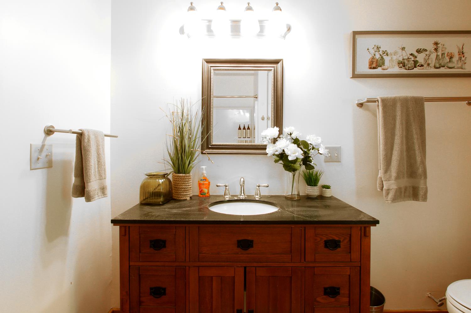 2936 E Highway Murphys, CA 95247 - Photo 38 of 41 a bathroom with a sink and a mirror