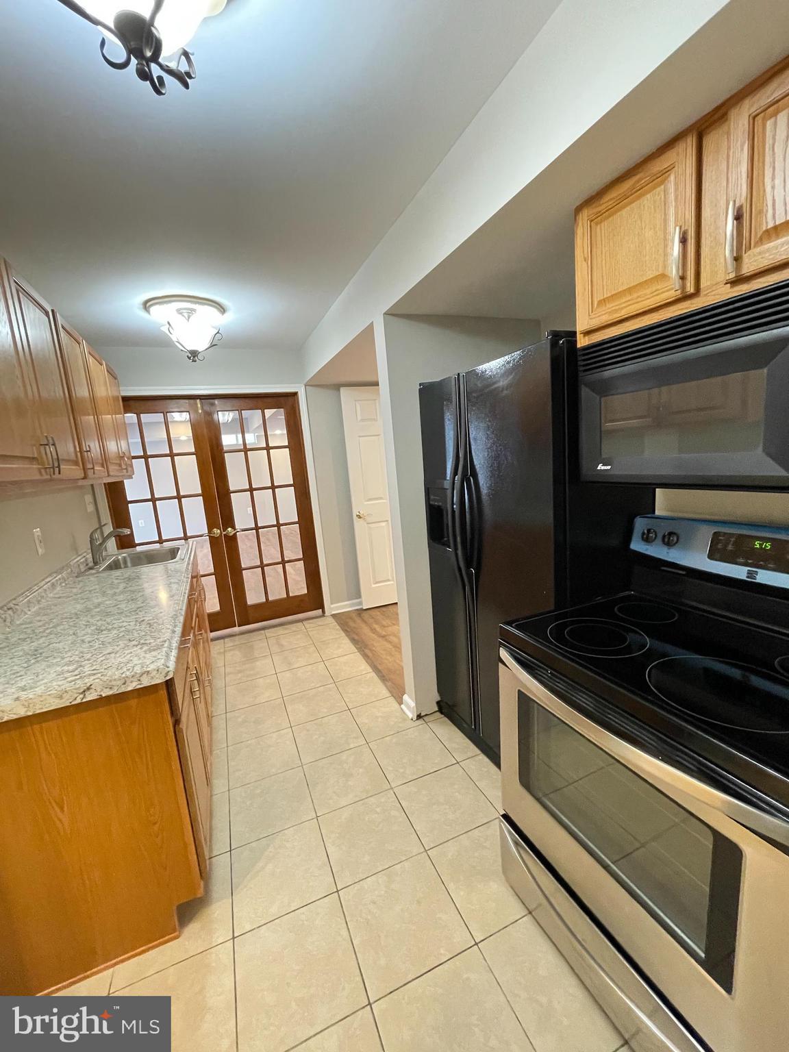 139 Balc Spring Leesburg, VA 20175 - Photo 6 of 18 a view of a kitchen with a sink and cabinets