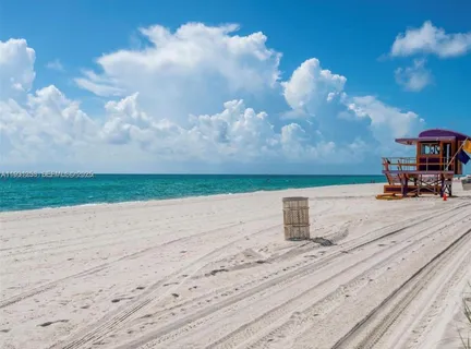 a sign board with a park on the side of the road