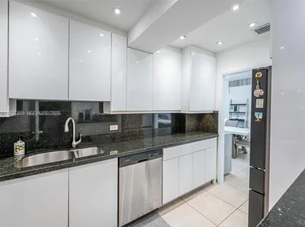 a bedroom with a bed and a desk