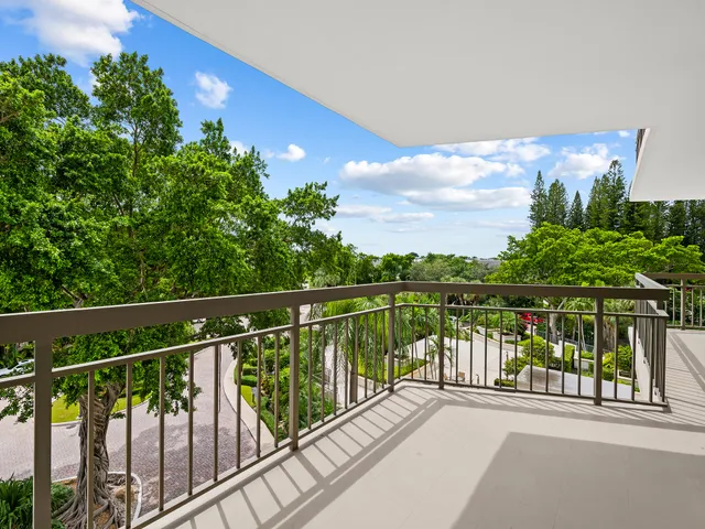 a view of balcony with yard and lake view