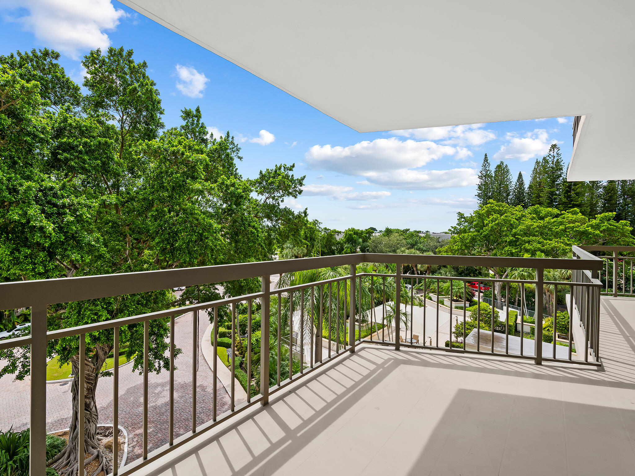 901 East Camino Real, Unit 4D Boca Raton, FL 33432 - Photo 28 of 37 a view of balcony with yard and lake view