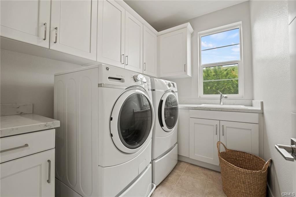 63 Cetus Irvine, CA 92618 - Photo 8 of 9 a utility room with sink dryer and washer