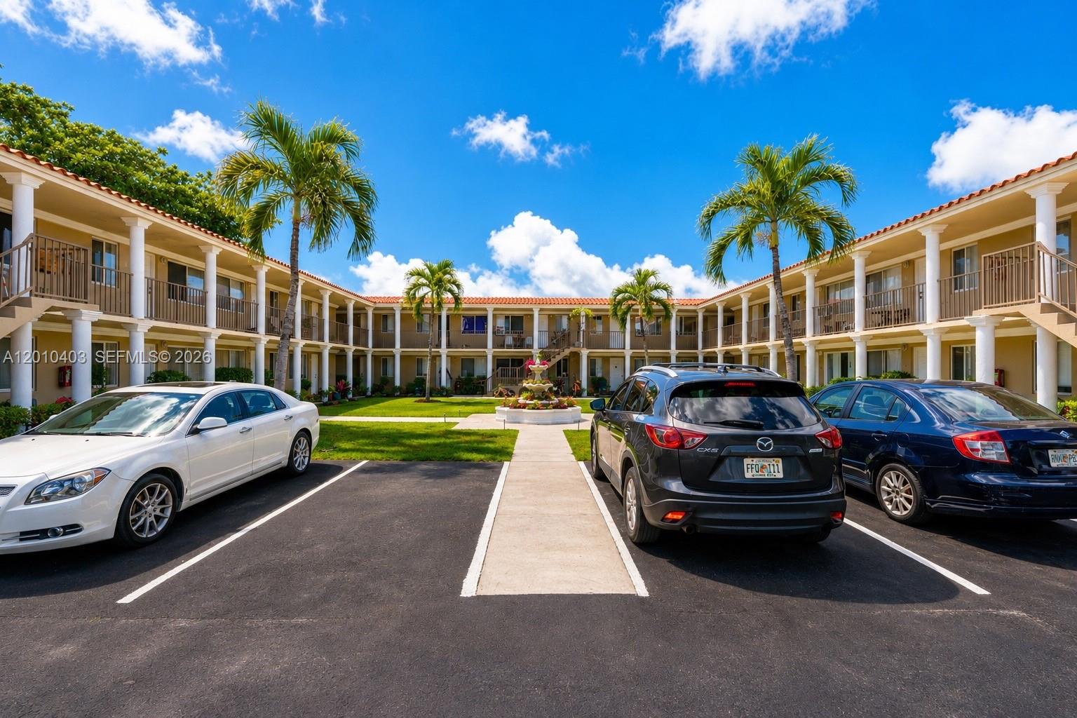 420 Northwest 10th Street, Unit 1 Miami, FL 33136 - Photo 1 of 7 a view of street with parked cars