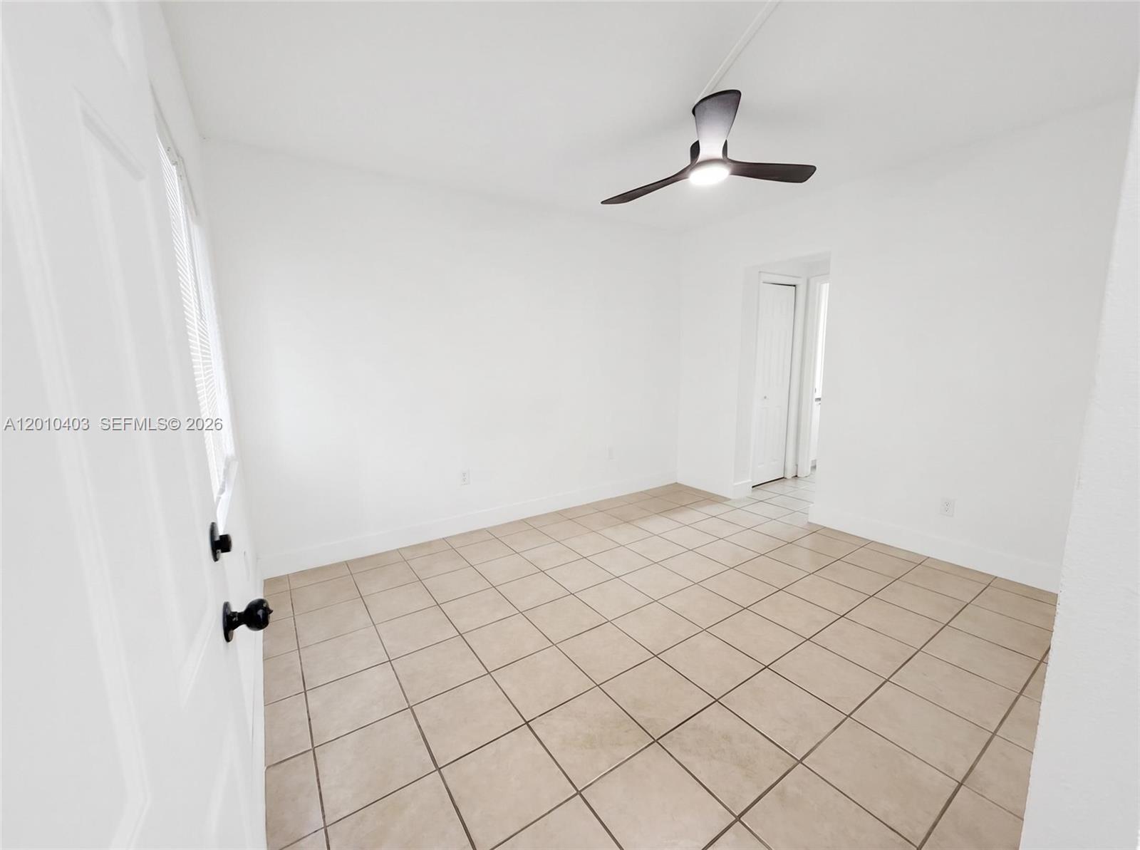 420 Northwest 10th Street, Unit 1 Miami, FL 33136 - Photo 3 of 7 a view of a room & rack on the wall