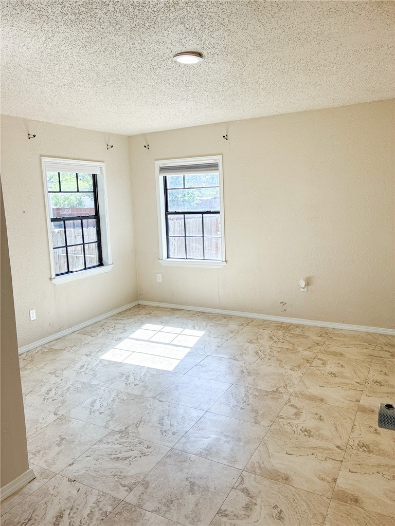 Undisclosed Address Three Rivers, TX 78071 - Photo 6 of 12 an empty room with windows