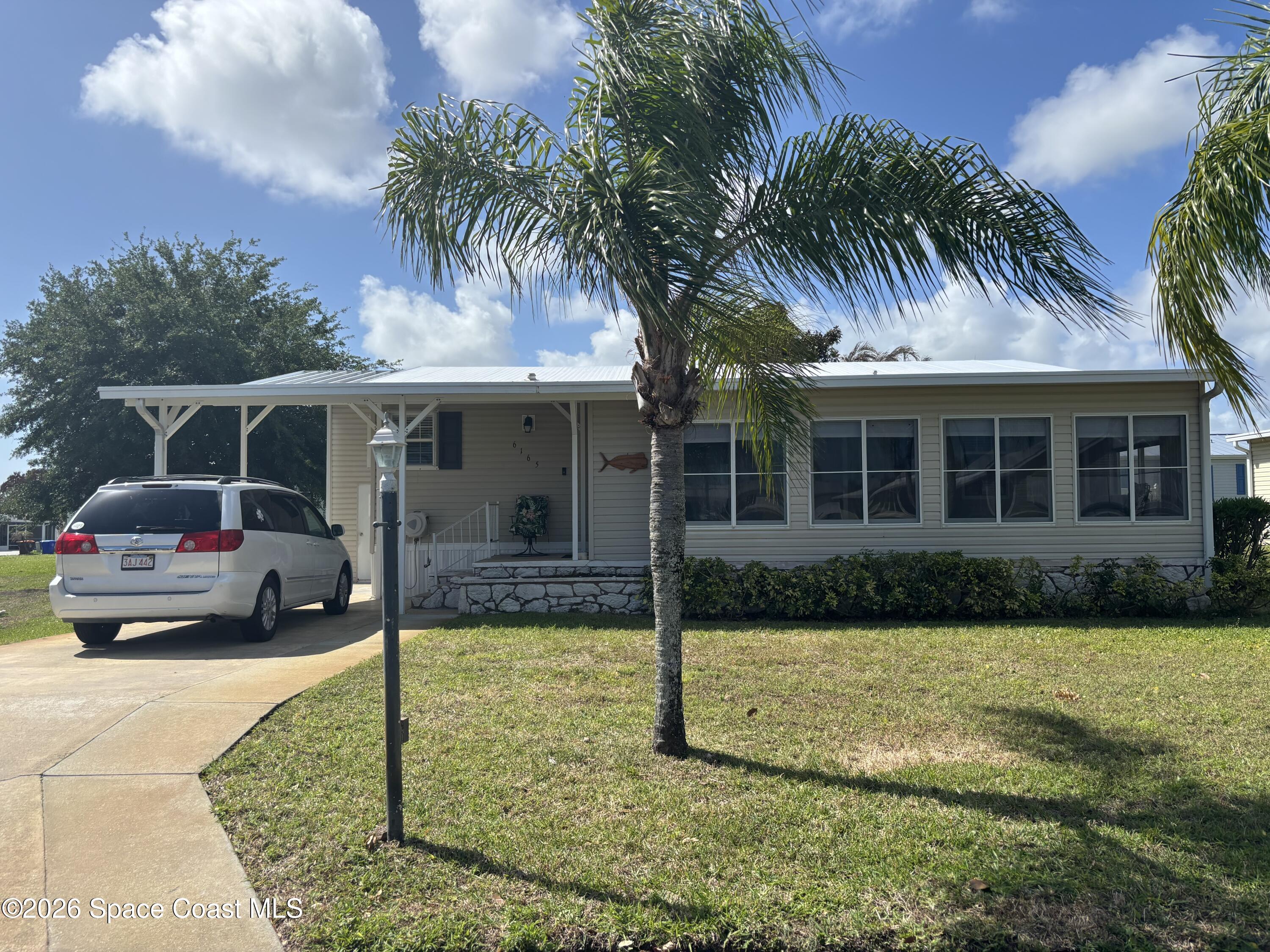 6165 98th Road Sebastian, FL 32958 - Photo 2 of 23 a view of front a house with a patio
