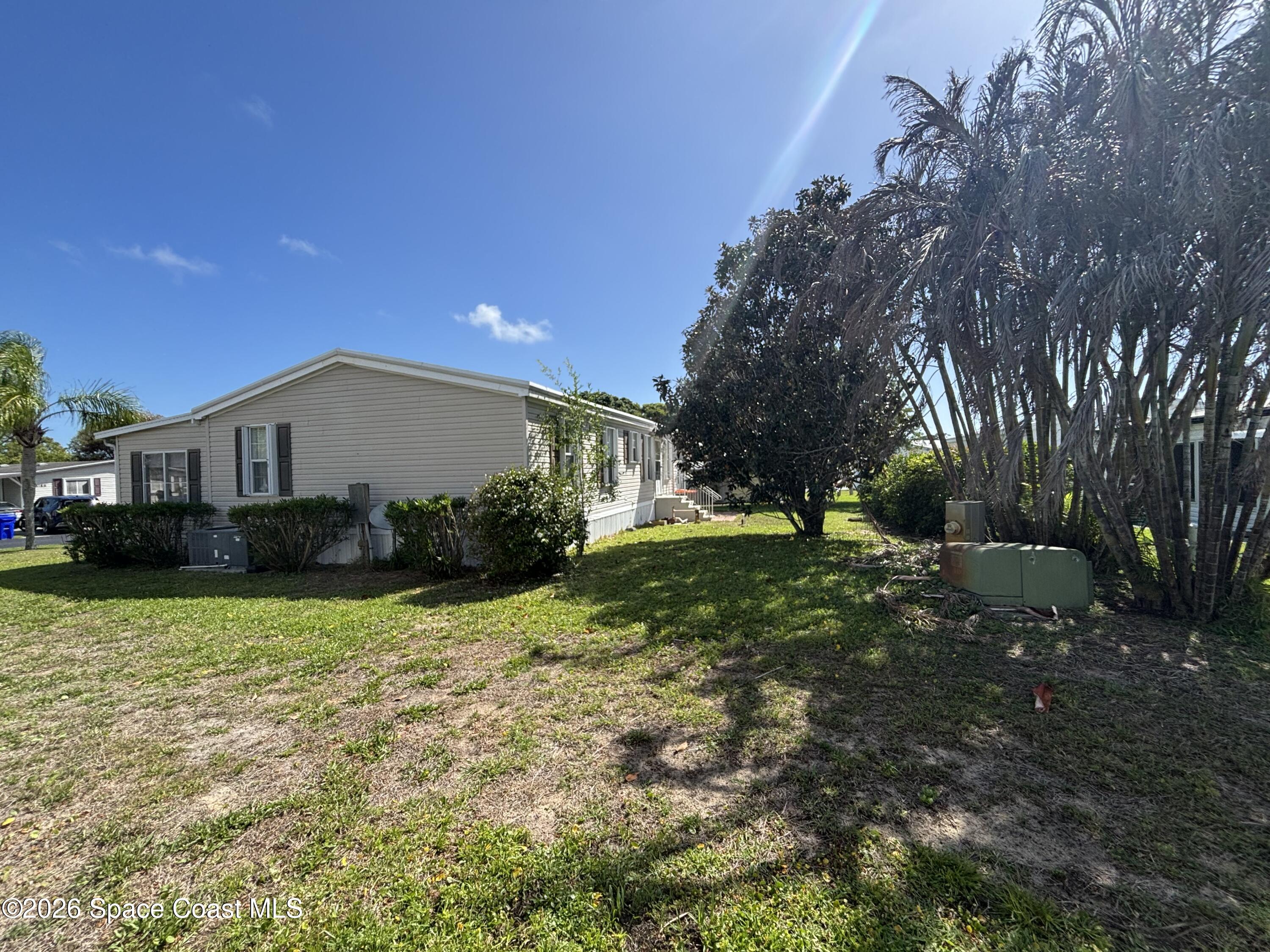 6165 98th Road Sebastian, FL 32958 - Photo 7 of 23 a view of a house with a yard