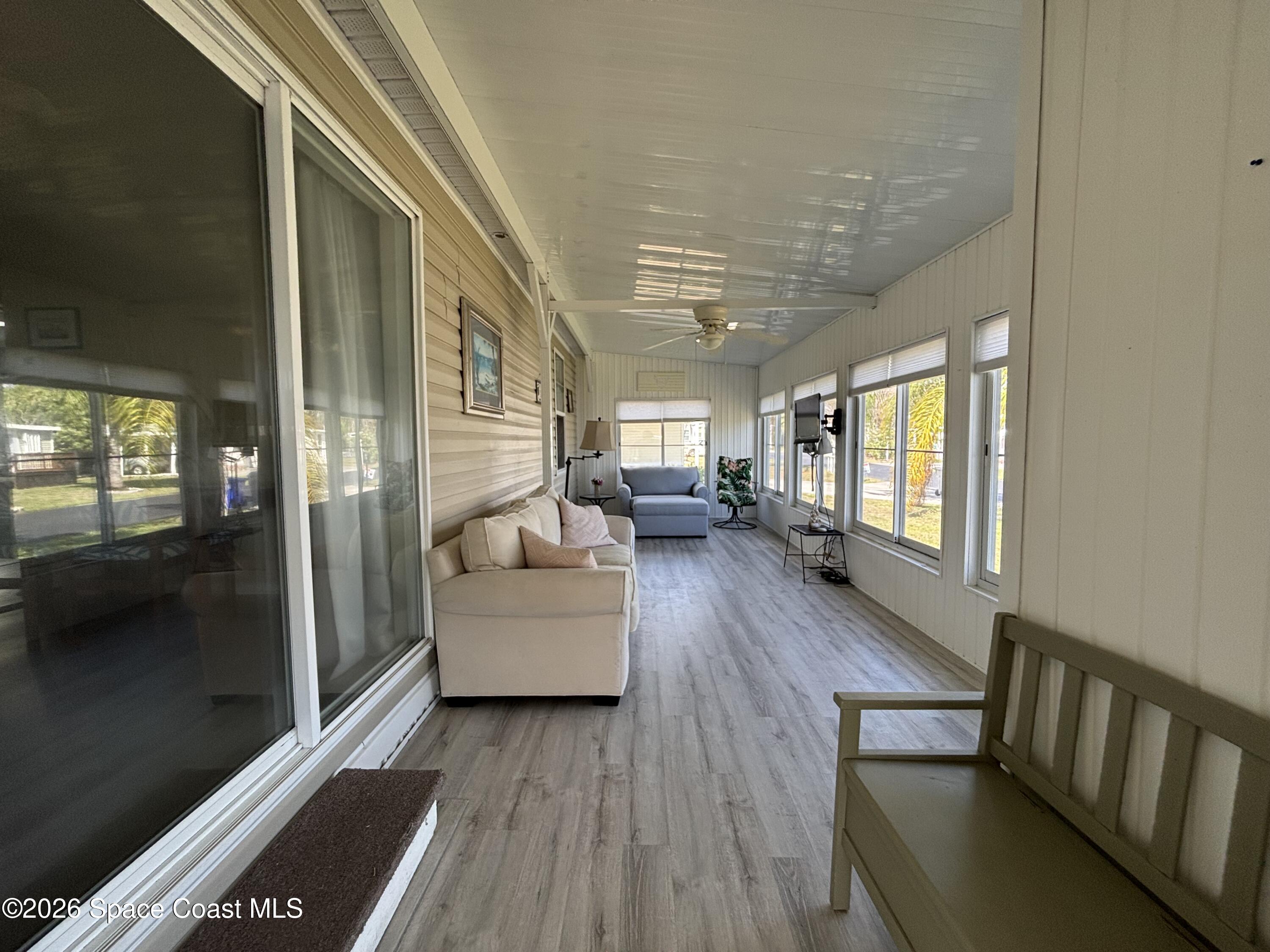 6165 98th Road Sebastian, FL 32958 - Photo 8 of 23 a living room with furniture and a wooden floor