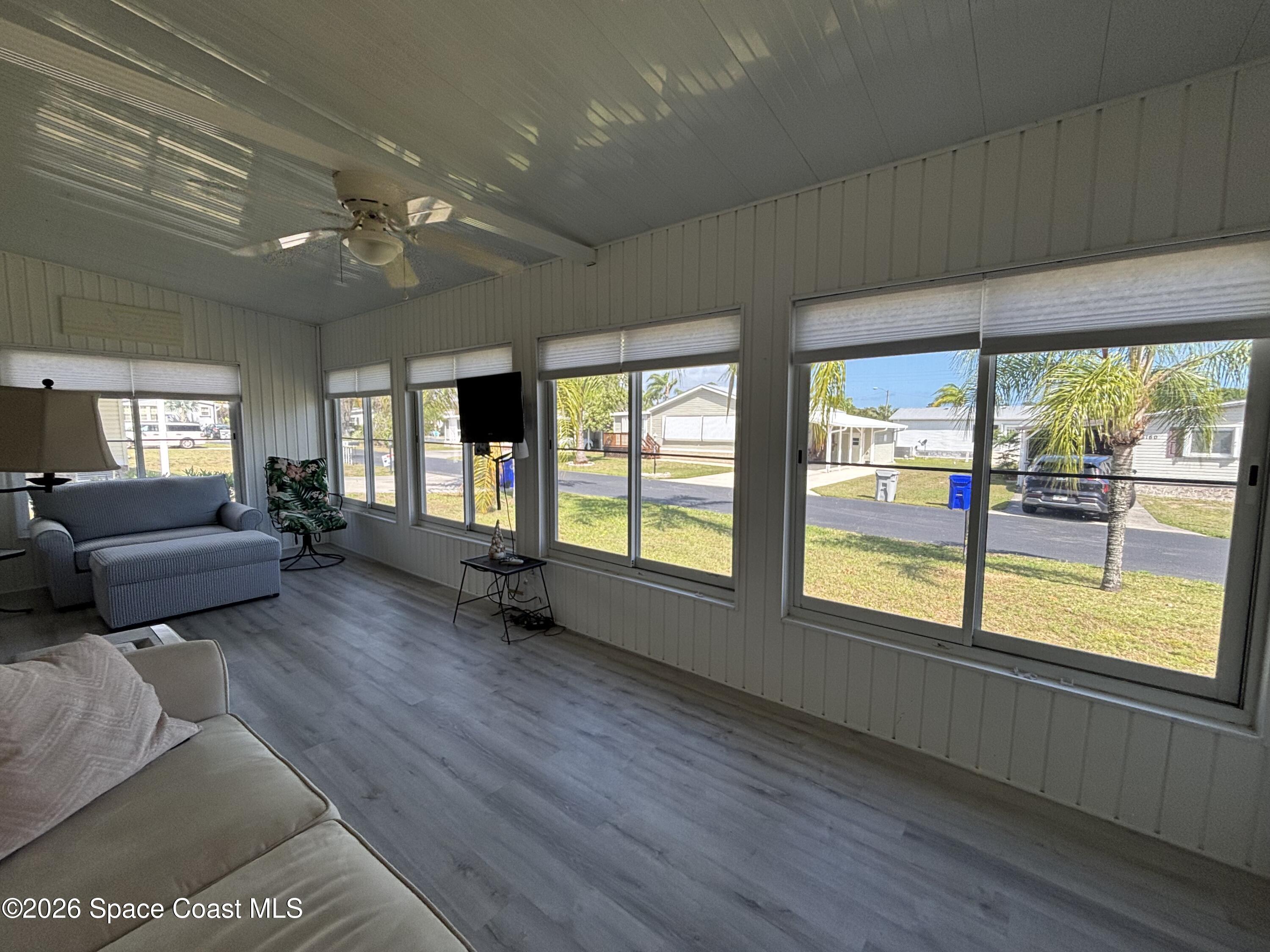 6165 98th Road Sebastian, FL 32958 - Photo 10 of 23 a living room with furniture and large windows