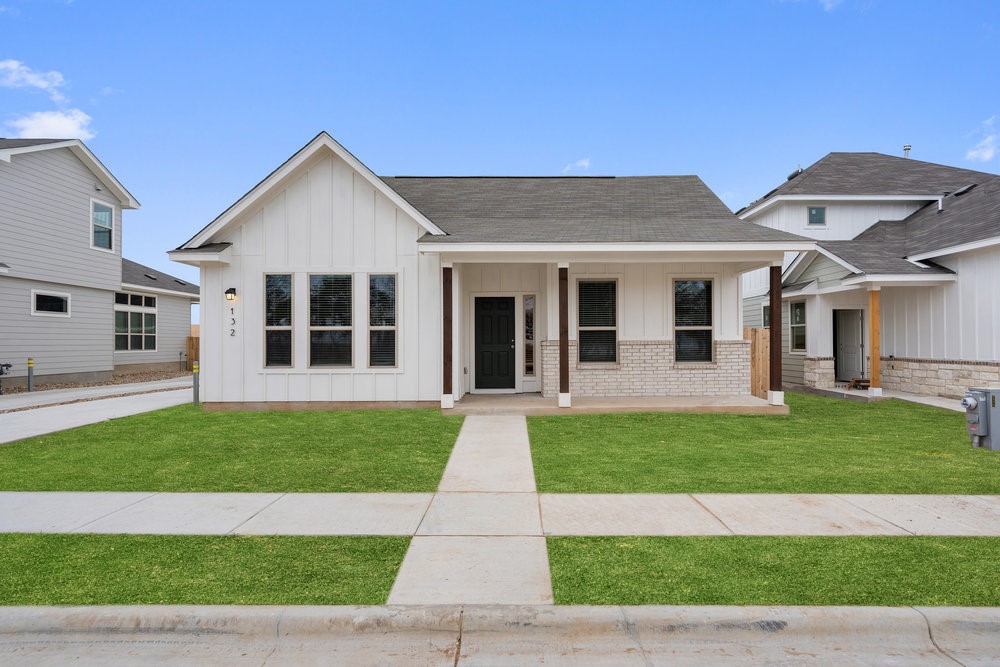 a view of a yard in front of a house