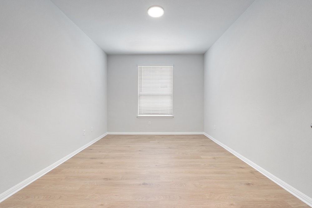 132 Condesa Street Kyle, TX 78640 - Photo 20 of 26 an empty room with a window