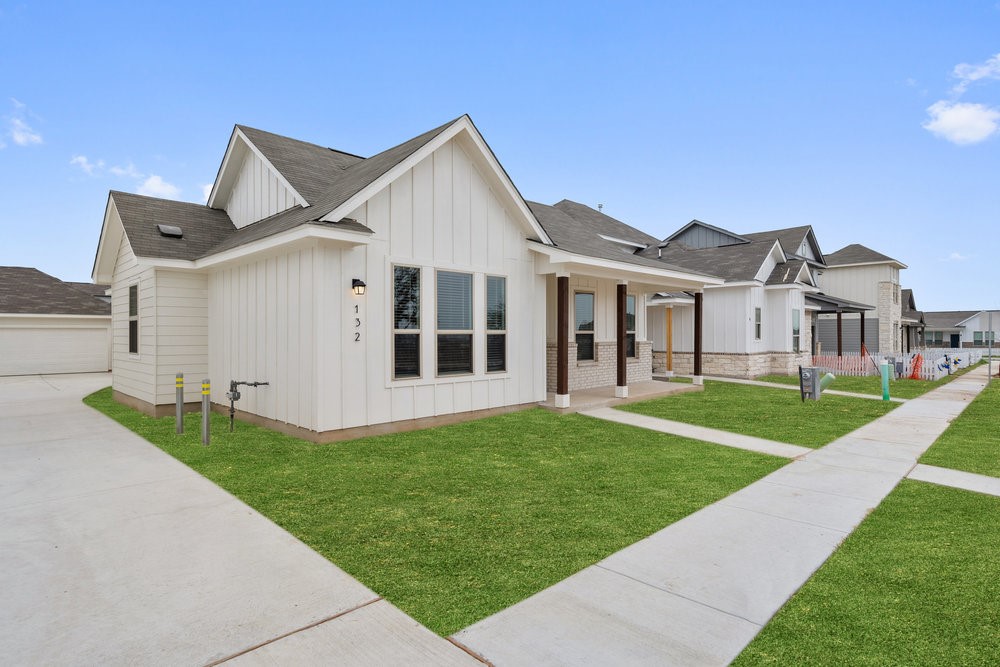 132 Condesa Street Kyle, TX 78640 - Photo 2 of 26 a view of a house with a yard