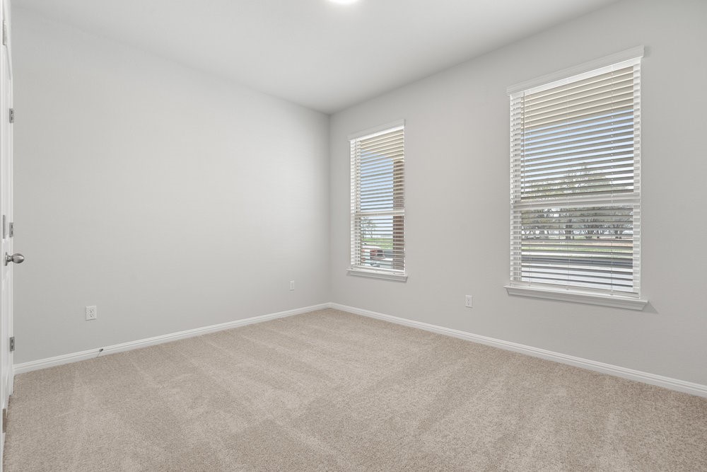 132 Condesa Street Kyle, TX 78640 - Photo 21 of 26 an empty room with a window
