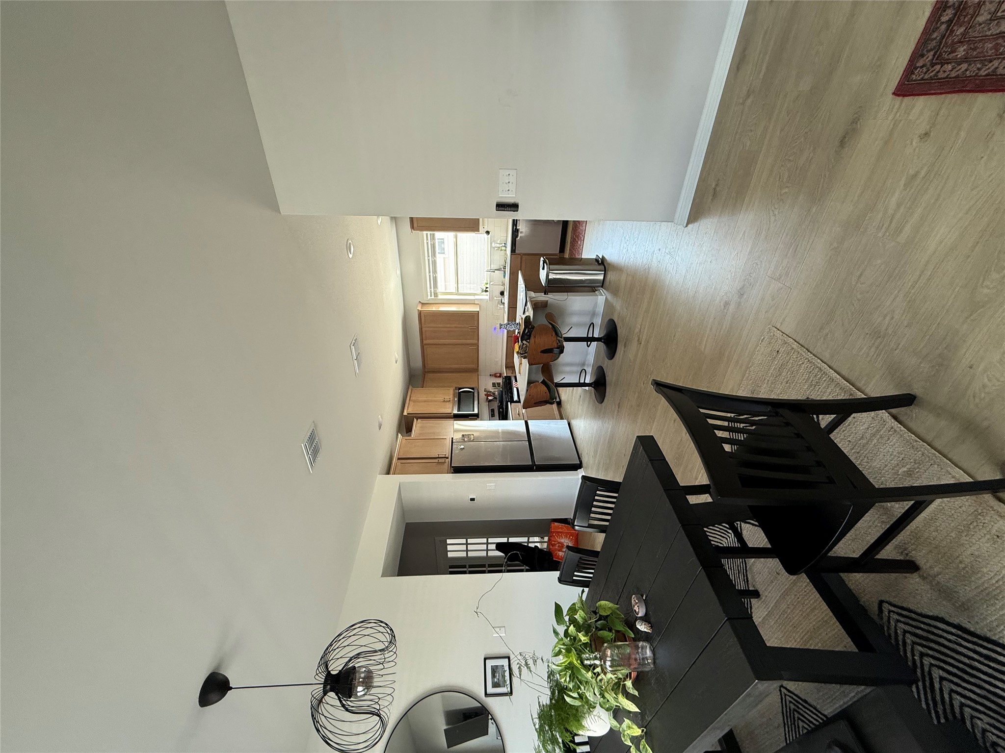 132 Condesa Street Kyle, TX 78640 - Photo 7 of 26 a view of a dining room with furniture and chandelier