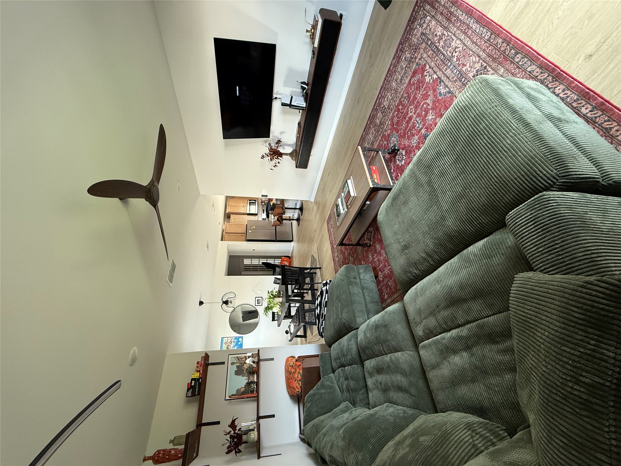 132 Condesa Street Kyle, TX 78640 - Photo 8 of 26 a living room with furniture and a flat screen tv